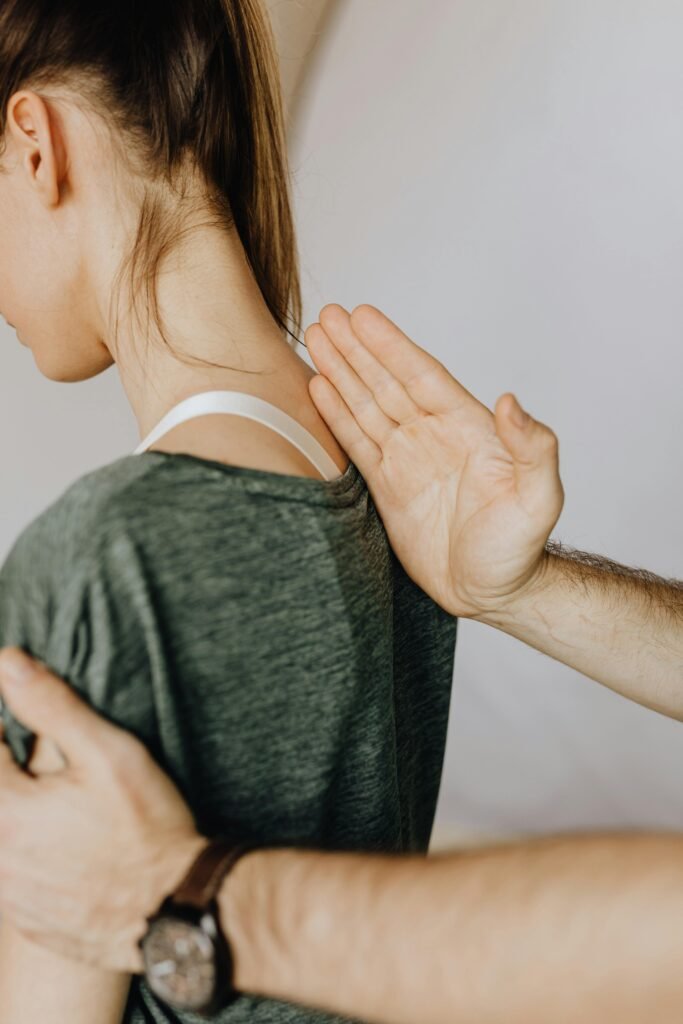 pexels-photo-4506076-4506076 Side view of crop unrecognizable orthopedist in wristwatch examining anonymous woman in casual clothes in doctor office in hospital