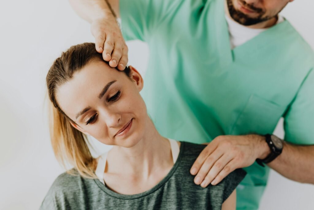 pexels-photo-4506217-4506217 Chiropractor treating a female patient for neck pain and posture alignment.