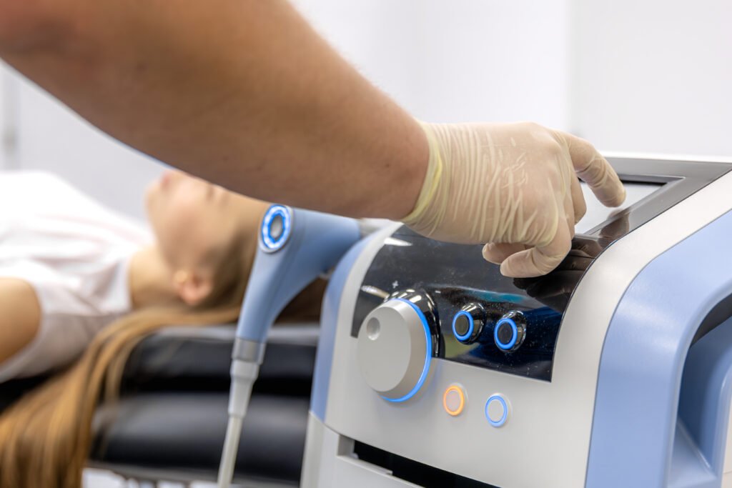 physiotherapist performs ultrasound therapy on female patient knee. joint rehabilitation. physiotherapist performs ultrasound therapy on female patient knee. joint rehabilitation.