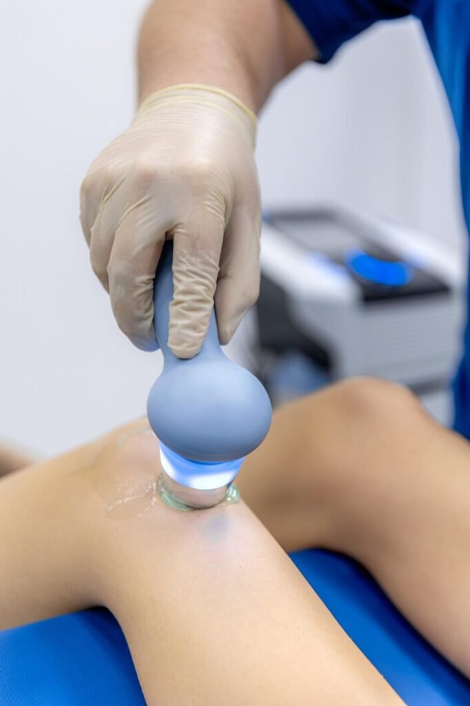 physiotherapist performs ultrasound therapy female patient knee joint rehabilitation 169016 71690 physiotherapist performs ultrasound therapy female patient knee joint rehabilitation 169016 71690